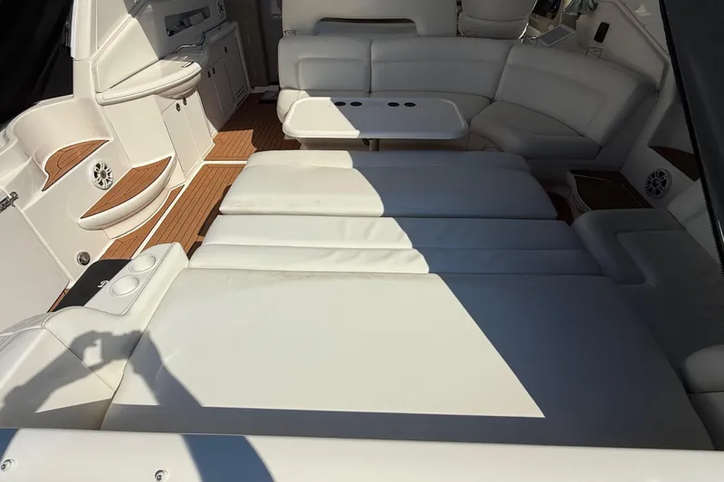 Slide: The Image of Luxurious interior of 2003 Sea Ray 460 Sundancer yacht with elegant seating and kitchen area. - 22