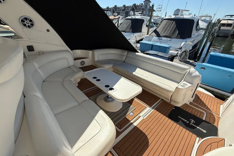 Slide: The Image of Luxurious interior of 2003 Sea Ray 460 Sundancer yacht with elegant seating and wooden cabinetry. - 25