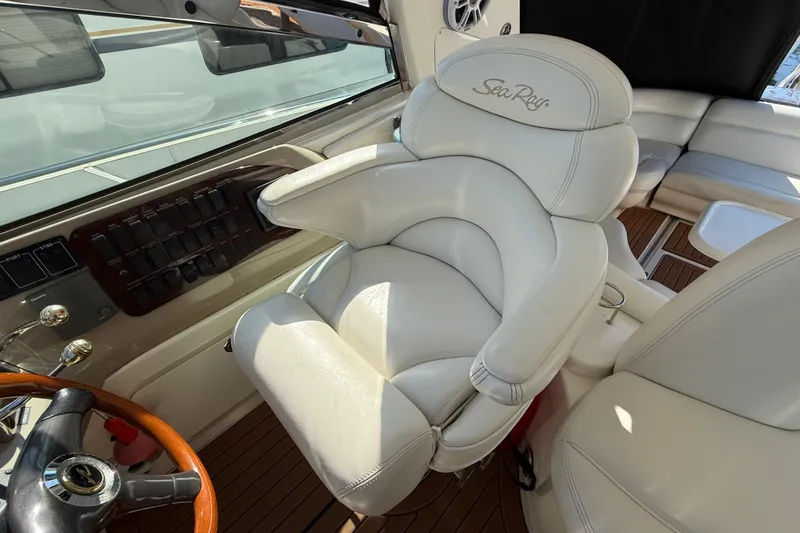 Slide: The Image of Interior of 2003 Sea Ray 460 Sundancer yacht with elegant wood finishes and plush seating. - 28