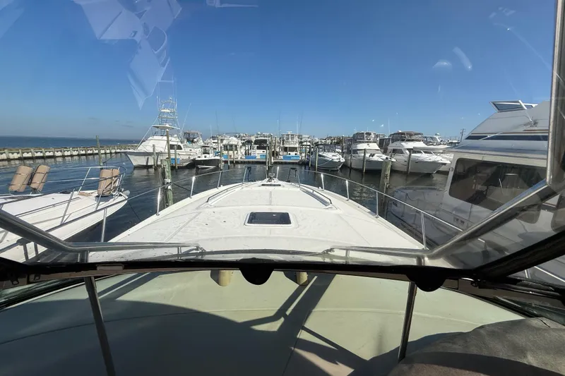 Slide: The Image of Luxurious bathroom in 2003 Sea Ray 460 Sundancer yacht, featuring shower, sink, and toilet. - 31