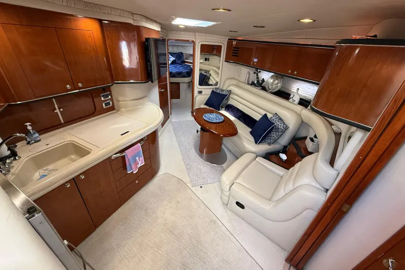Slide: The Image of Bathroom interior of 2003 Sea Ray 460 Sundancer yacht, featuring shower, sink, and mirror. - 32