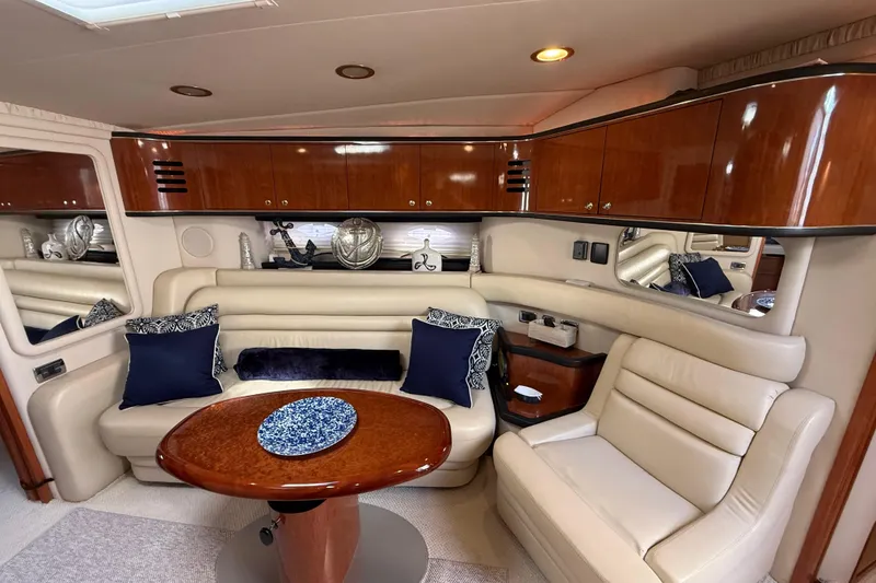 Slide: The Image of Luxurious interior of 2003 Sea Ray 460 Sundancer yacht with elegant seating and modern amenities. - 34