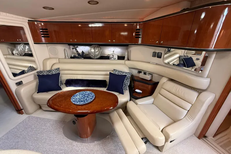 Slide: The Image of Luxurious interior of 2003 Sea Ray 460 Sundancer with cream leather seating and elegant decor. - 35