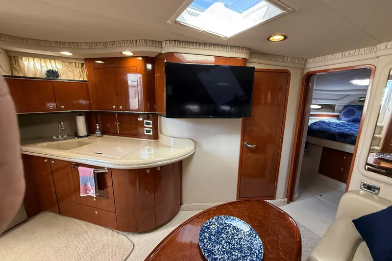 Slide: The Image of Bathroom interior of 2003 Sea Ray 460 Sundancer yacht, featuring shower, sink, and toilet. - 36