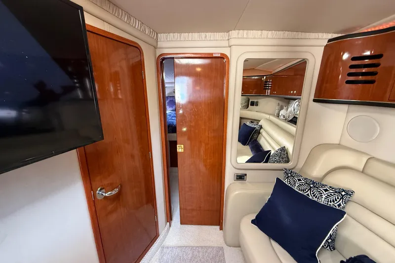 Slide: The Image of Luxurious interior of 2003 Sea Ray 460 Sundancer yacht with plush seating and elegant design. - 38