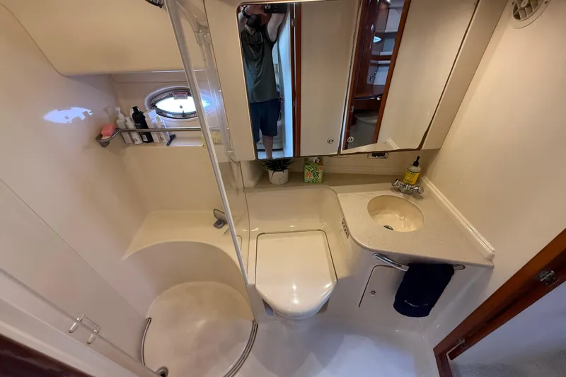 Slide: The Image of 2003 Sea Ray 460 Sundancer yacht deck with shadow, docked at marina. - 42