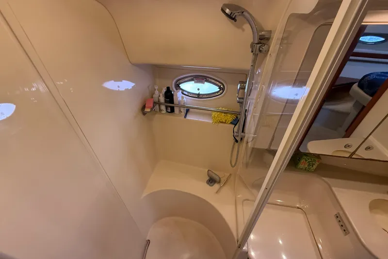 Slide: The Image of Bow view of 2003 Sea Ray 460 Sundancer yacht on calm water. - 43