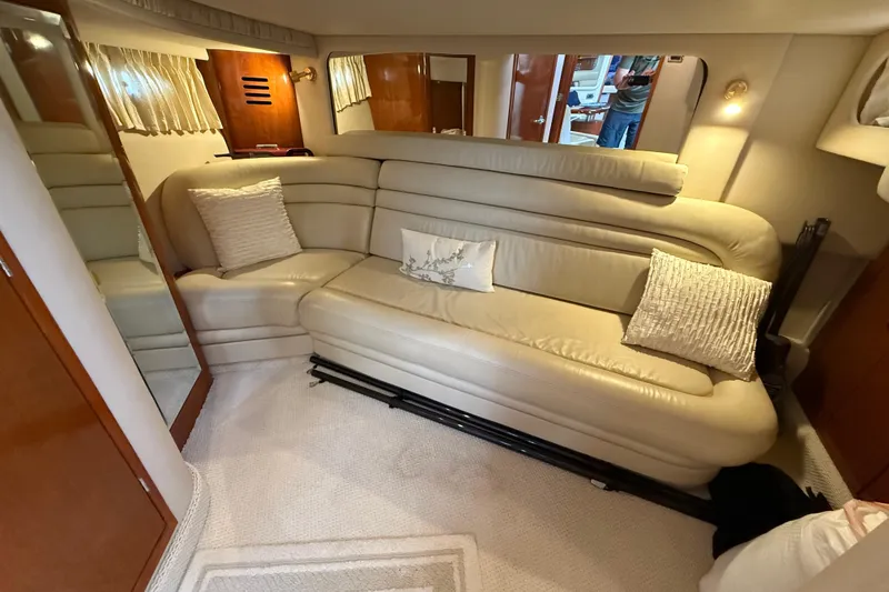 Slide: The Image of Luxurious 2003 Sea Ray 460 Sundancer yacht kitchen with wood cabinetry and modern appliances. - 45