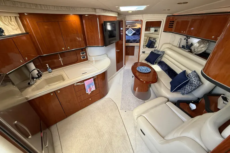 Slide: The Image of Engine compartment of a 2003 Sea Ray 460 Sundancer boat, showcasing mechanical components. - 49