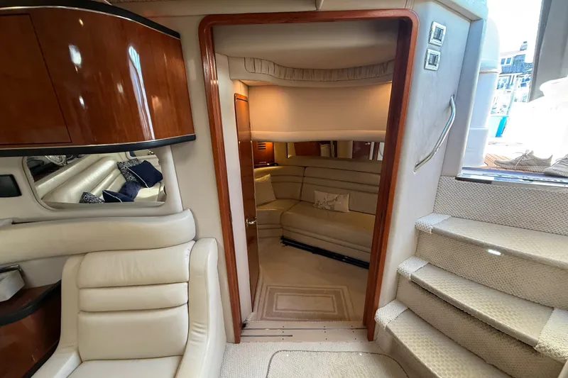 Slide: The Image of Engine compartment of a 2003 Sea Ray 460 Sundancer boat, showcasing mechanical components. - 50