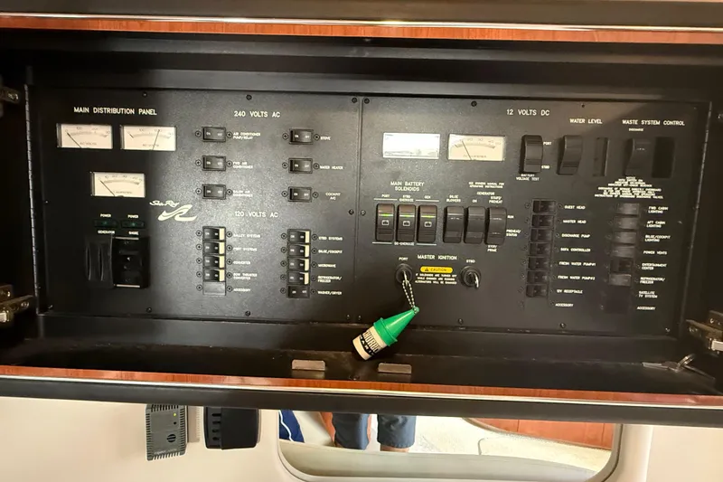 Slide: The Image of 2003 Sea Ray 460 Sundancer yacht cruising on open water. - 56