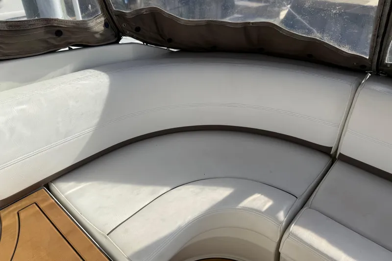 Slide: The Image of 2008 Cruisers Yachts 420 Express interior seating with white upholstery and wooden accents. - 25