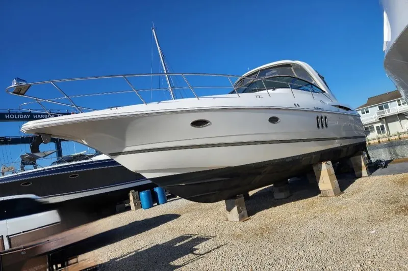 Slide: The Image of 2008 Cruisers Yachts 420 Express docked at marina, featuring sleek design and spacious deck. - 12