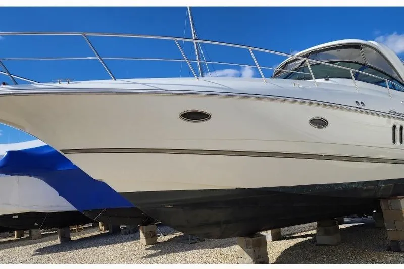 Slide: The Image of 2008 Cruisers Yachts 420 Express docked, rear view, with "Alla Luna" name visible. - 13