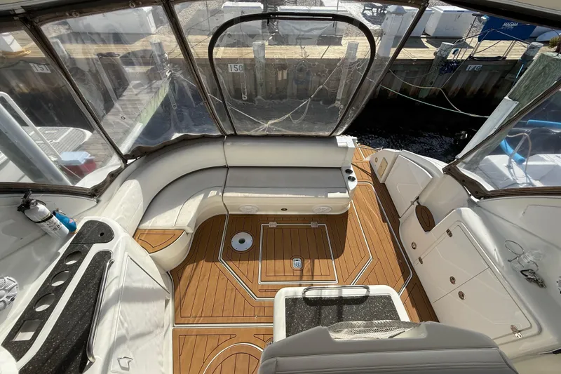 Slide: The Image of 2008 Cruisers Yachts 420 Express cockpit with teak flooring and seating area. - 24