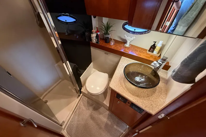 Slide: The Image of Luxurious bathroom in 2008 Cruisers Yachts 420 Express with glass sink and shower. - 34
