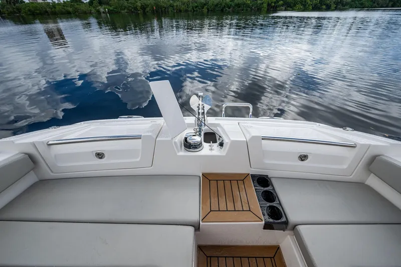 Slide: The Image of Aquila 32 Power Cat 2023 boat deck with seating and water view. - 11