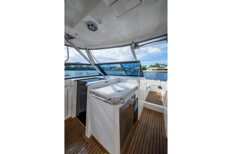Slide: The Image of 2023 Aquila 32 Power Cat interior with sleek design and waterfront view. - 24