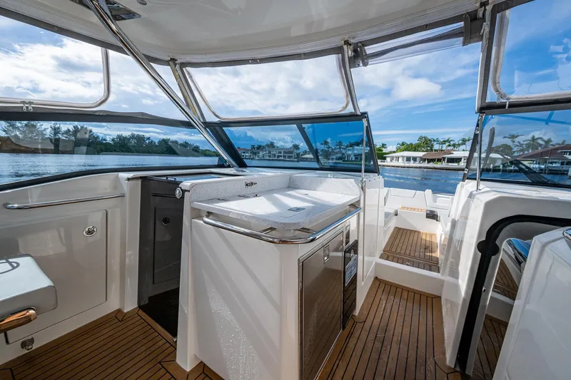 Slide: The Image of 2023 Aquila 32 Power Cat interior with sleek design and waterfront view. - 25