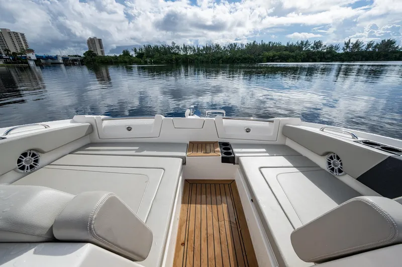 Slide: The Image of 2023 Aquila 32 Power Cat interior with spacious seating and scenic water view. - 8
