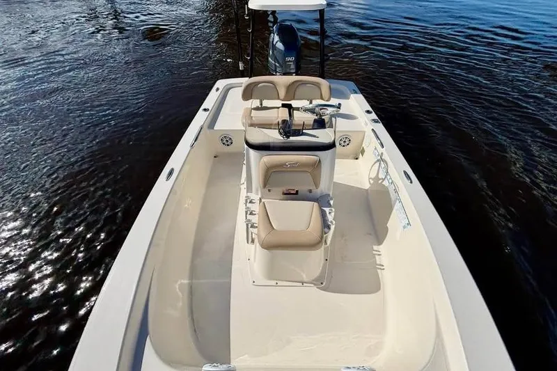 Slide: The Image of 2023 Scout 177 Sport boat on water, featuring sleek design and comfortable seating. - 5