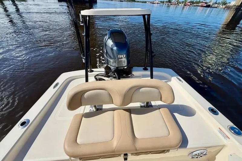 Slide: The Image of 2023 Scout 177 Sport boat with Yamaha 90 engine on calm water. - 9