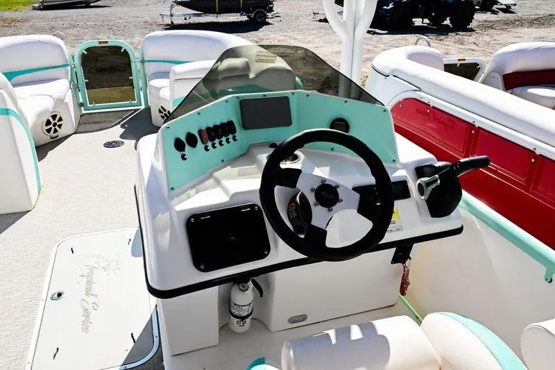 Slide: The Image of 2022 Aloha Pontoon 260 Tropical Series Sundeck, featuring a modern helm and spacious seating. - 5