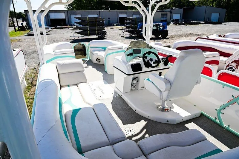 Slide: The Image of 2022 Aloha Pontoon 260 Tropical Series Sundeck with spacious seating and modern helm. - 7