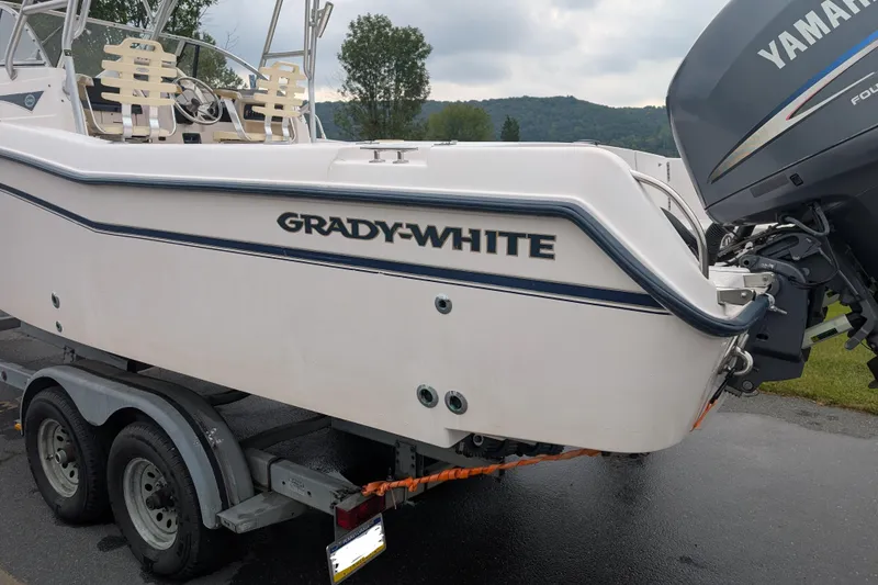 The Image of 2002 Grady-White Voyager 248 boat on trailer with Yamaha outboard motor. - 0