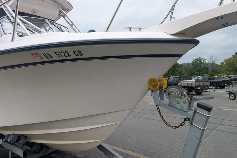 Slide: The Image of 2002 Grady-White Voyager 248 boat on trailer in parking lot. - 12