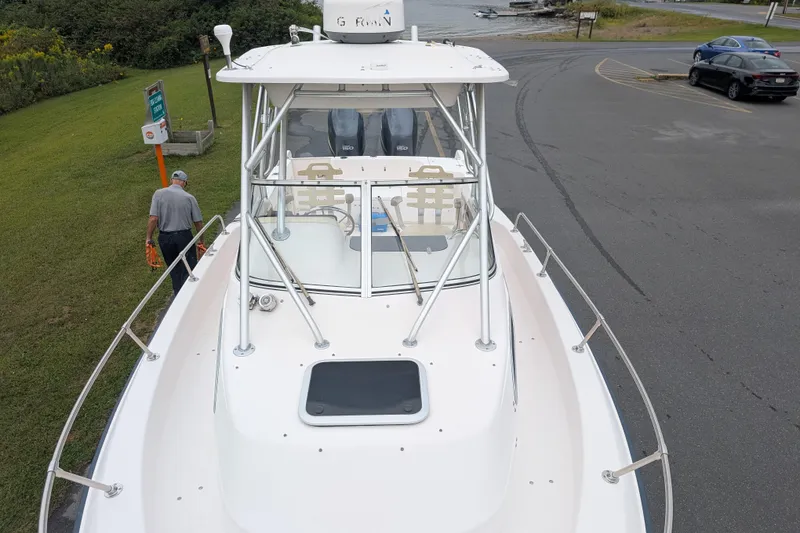 Slide: The Image of 2002 Grady-White Voyager 248 boat at dockside, viewed from above. - 2