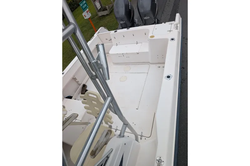 Slide: The Image of 2002 Grady-White Voyager 248 boat interior with seating and dual engines. - 3