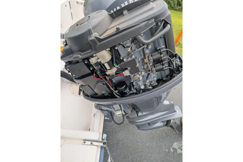 Slide: The Image of Open Yamaha outboard motor on a 2002 Grady-White Voyager 248 boat. - 7