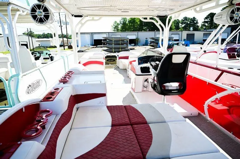 Slide: The Image of 2023 Aloha Pontoon 260 Paradise Series Sundeck with red and white seating, spacious layout. - 11