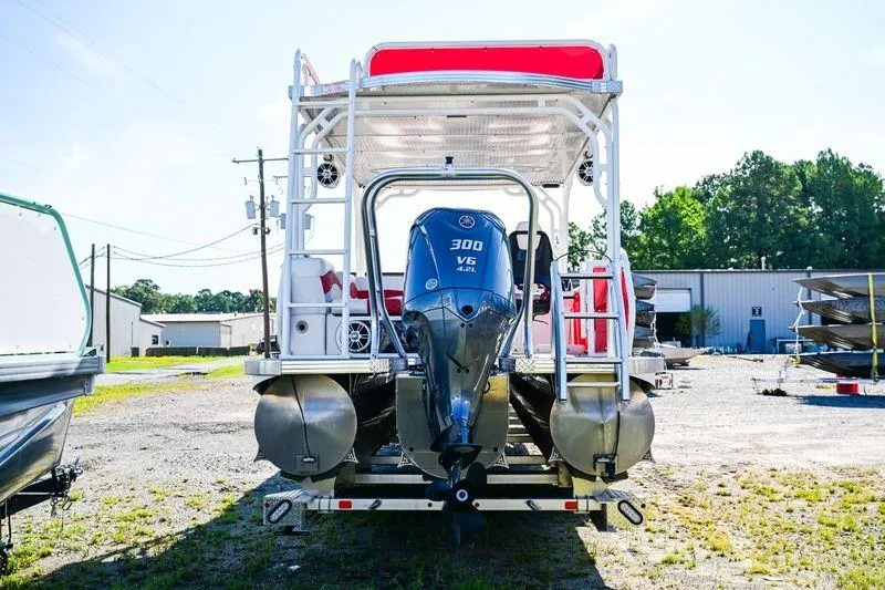 Slide: The Image of 2023 Aloha Pontoon 260 Paradise Series Sundeck with 300 V6 engine, rear view. - 3