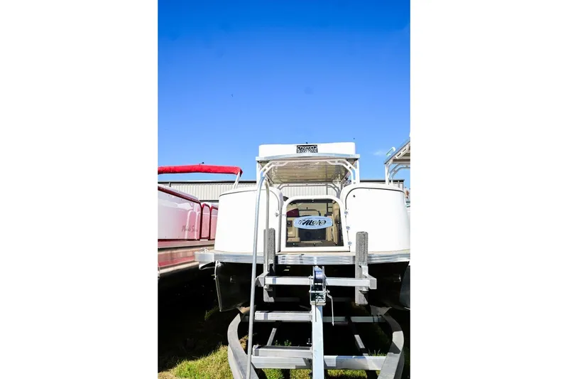 Slide: The Image of 2023 Aloha Pontoon 260 Paradise Series Sundeck, rear view, clear blue sky. - 6