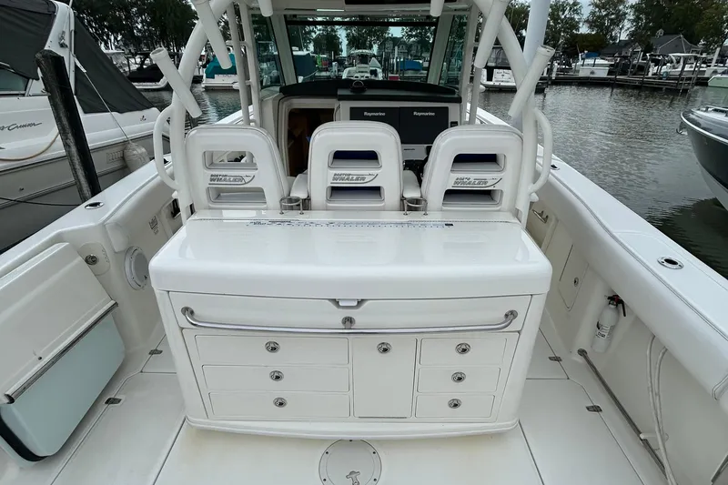 Slide: The Image of Interior cabin of 2016 Boston Whaler 370 Outrage with nautical-themed decor. - 15