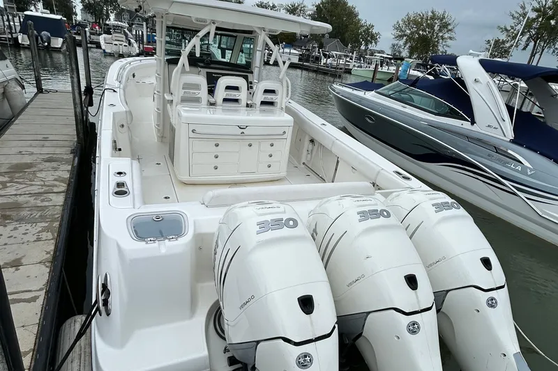 Slide: The Image of 2016 Boston Whaler 370 Outrage helm with dual Raymarine displays and controls. - 3