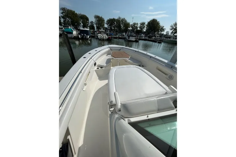 Slide: The Image of 2016 Boston Whaler 370 Outrage with triple Mercury outboard engines docked. - 8