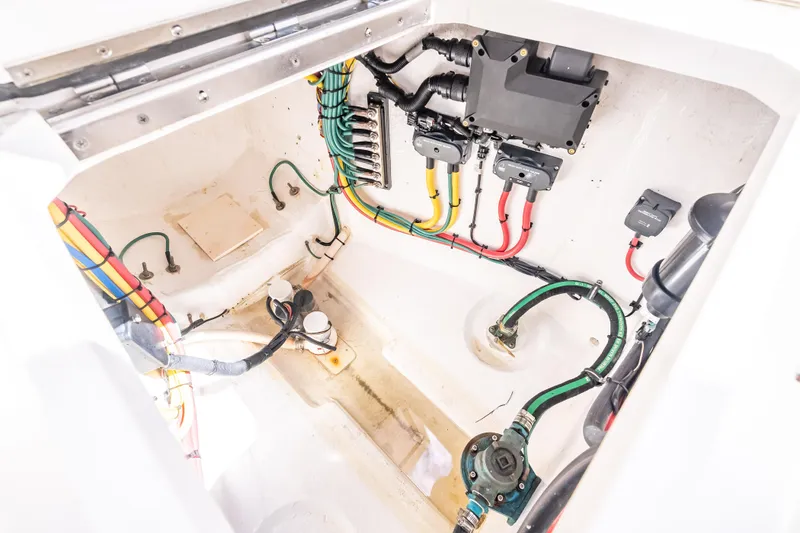 Slide: The Image of 2018 Intrepid 407 boat wiring and plumbing system in engine compartment. - 19