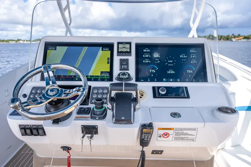 Slide: The Image of Cockpit of 2018 Intrepid 407 boat with advanced navigation and control systems. - 33