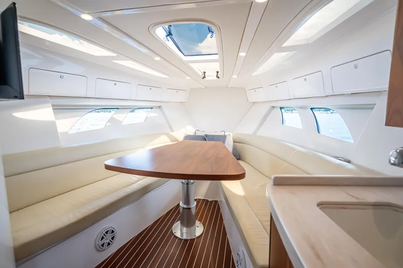Slide: The Image of Luxurious interior of 2018 Intrepid 407 yacht with elegant seating and wooden table. - 44