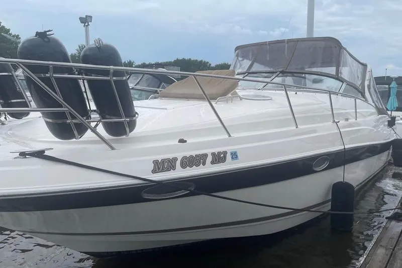 The Image of 2003 Regal Commodore 3560 IB boat docked with protective fenders, side view. - 0