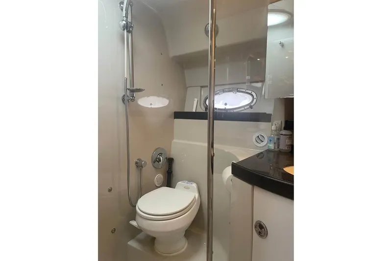 Slide: The Image of Bathroom interior of 2003 Regal Commodore 3560 IB yacht with shower and toilet. - 13