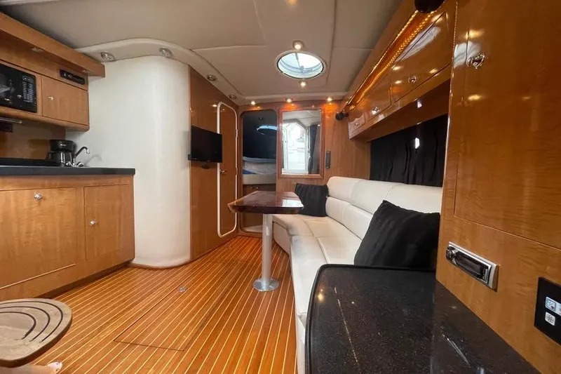 Slide: The Image of Luxurious interior of 2003 Regal Commodore 3560 IB yacht with wood finish and modern amenities. - 4