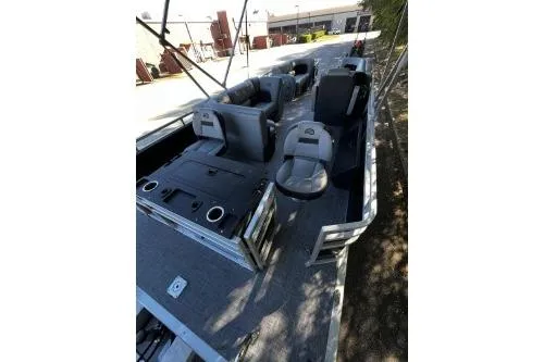 Slide: The Image of 2026 Sun Tracker SportFish 22 DLX pontoon boat with spacious seating and modern design. - 6