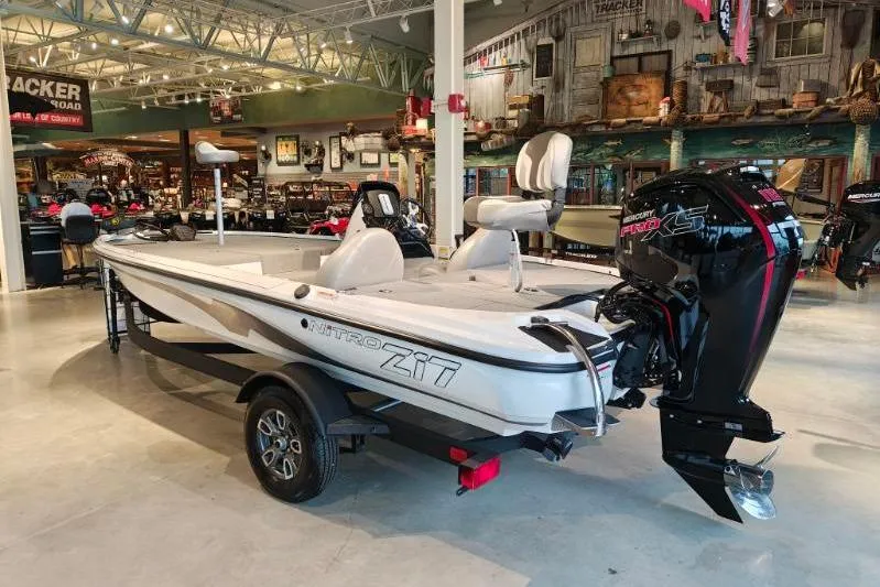 Slide: The Image of 2026 Nitro Z17 boat displayed in a showroom with Mercury Pro XS engine. - 1