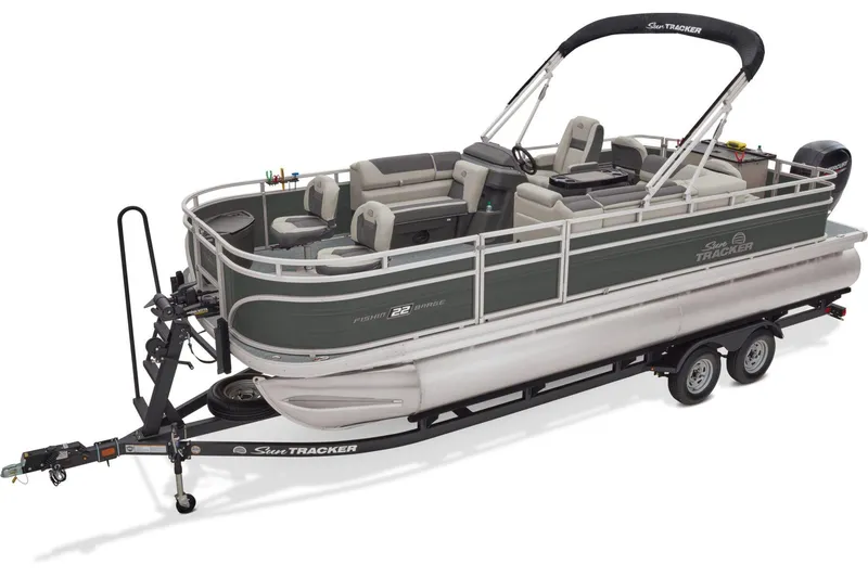 Slide: The Image of 2026 Sun Tracker Fishin' Barge 22 DLX interior with seating and carpeted deck. - 2
