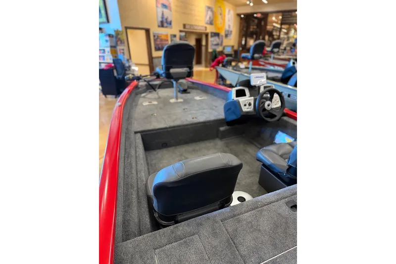 Slide: The Image of 2026 Tracker Pro Team 175 Crappie Edition boat interior with seating and steering console. - 10