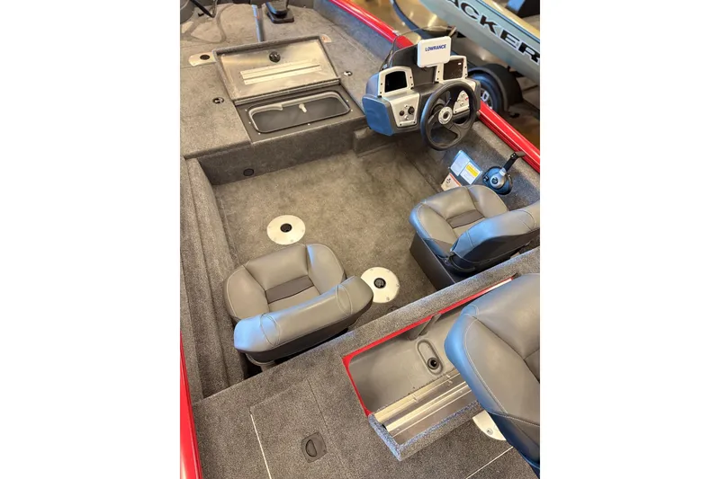 Slide: The Image of 2026 Tracker Pro Team 175 Crappie Edition boat interior with seats and steering console. - 14